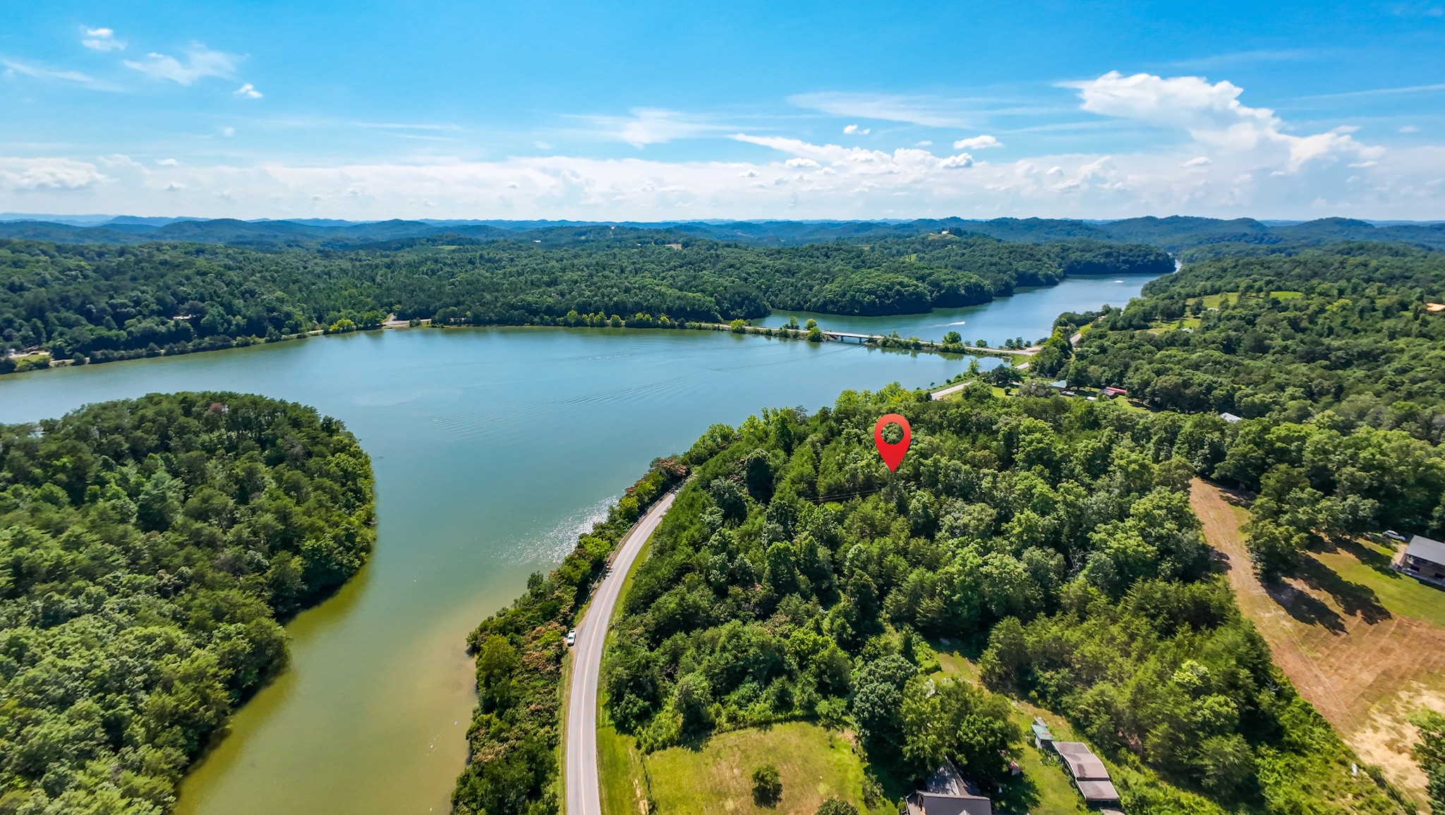 151 Citico Road Vonore, TN 37885 - Photo 12 of 23 a view of a lake with a city