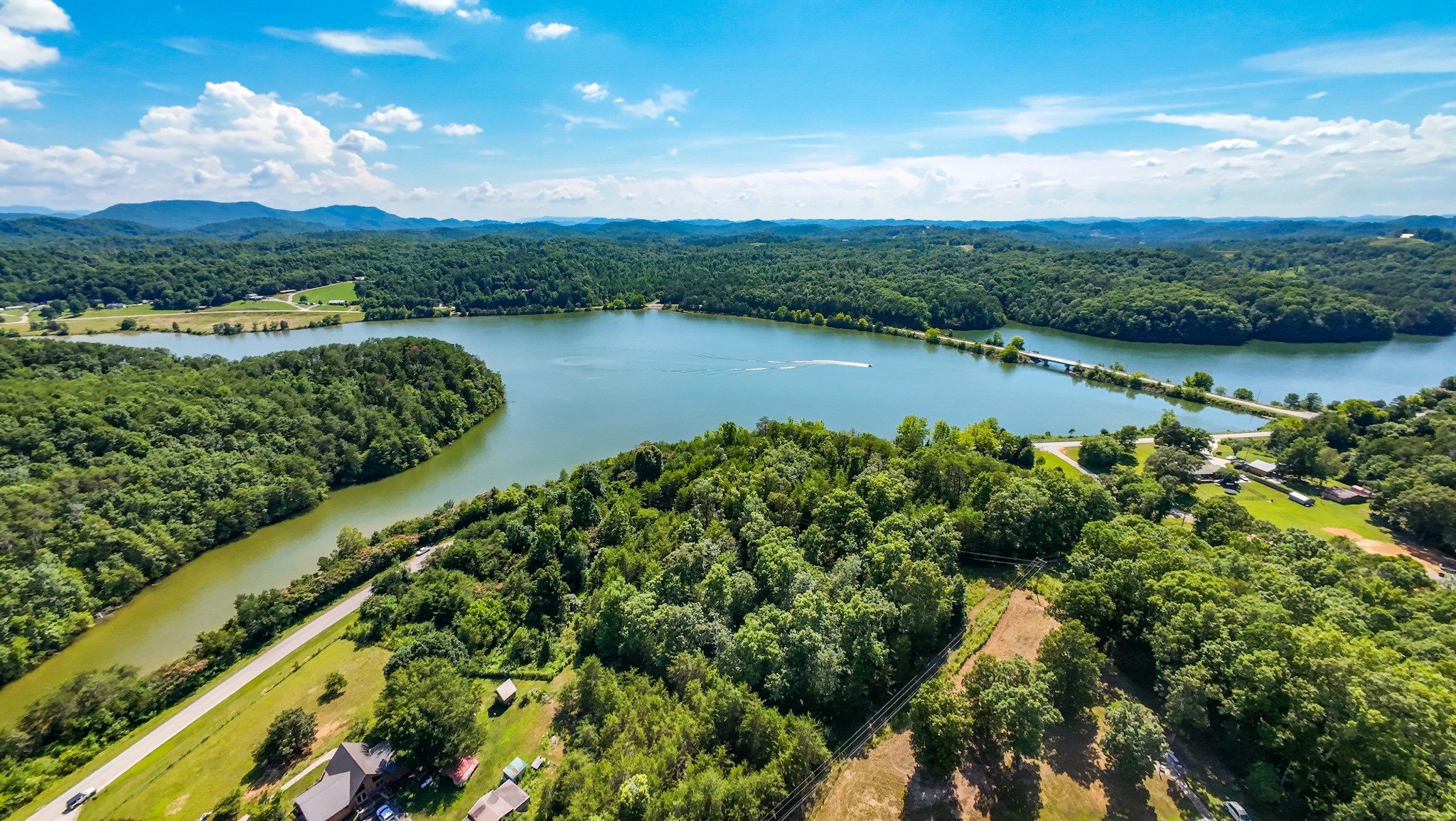 151 Citico Road Vonore, TN 37885 - Photo 13 of 23 a view of a lake with a city