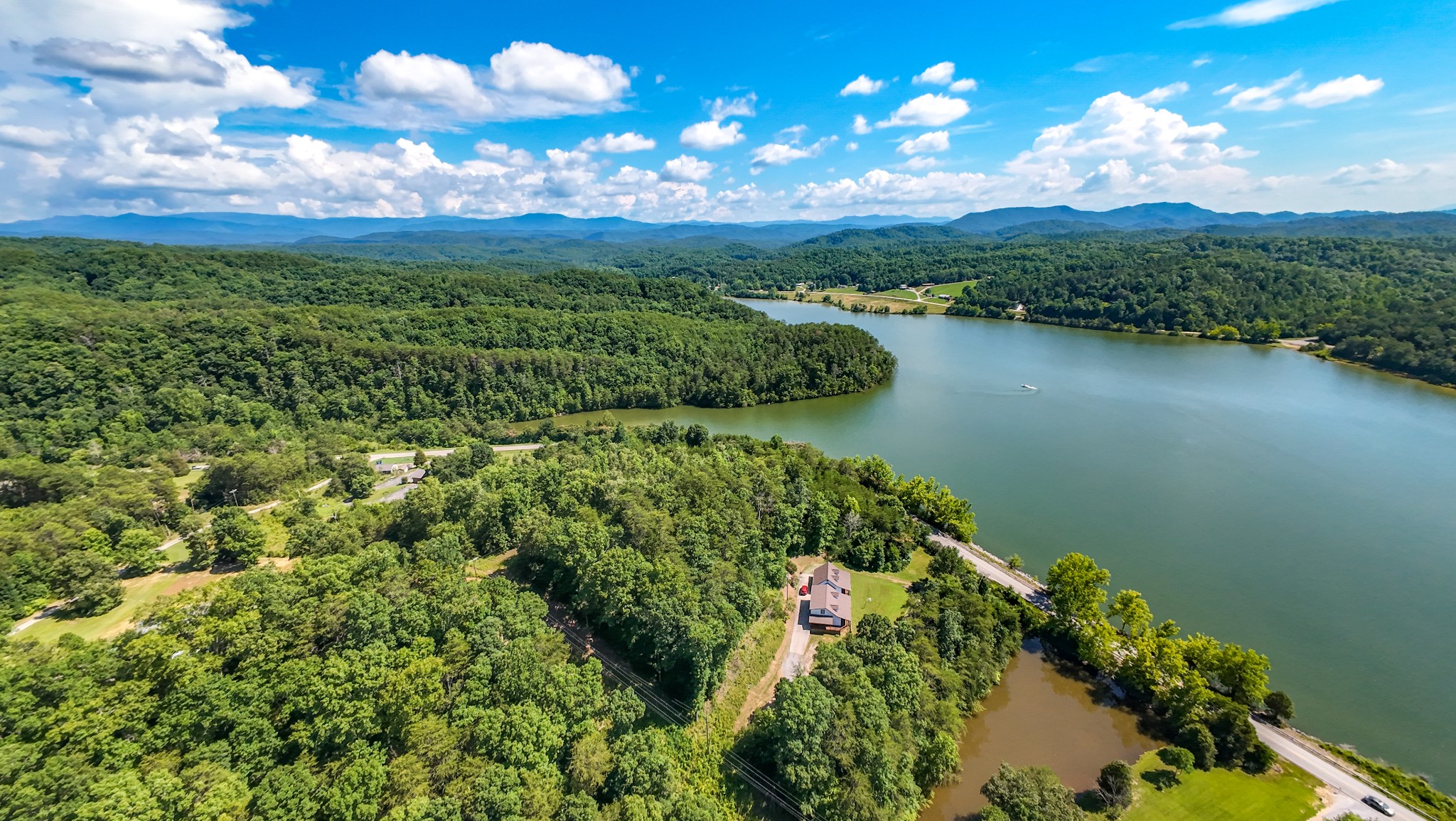 151 Citico Road Vonore, TN 37885 - Photo 16 of 23 a view of a lake with a city
