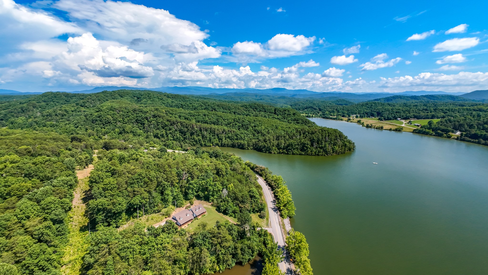 151 Citico Road Vonore, TN 37885 - Photo 18 of 23 a view of a lake with a city
