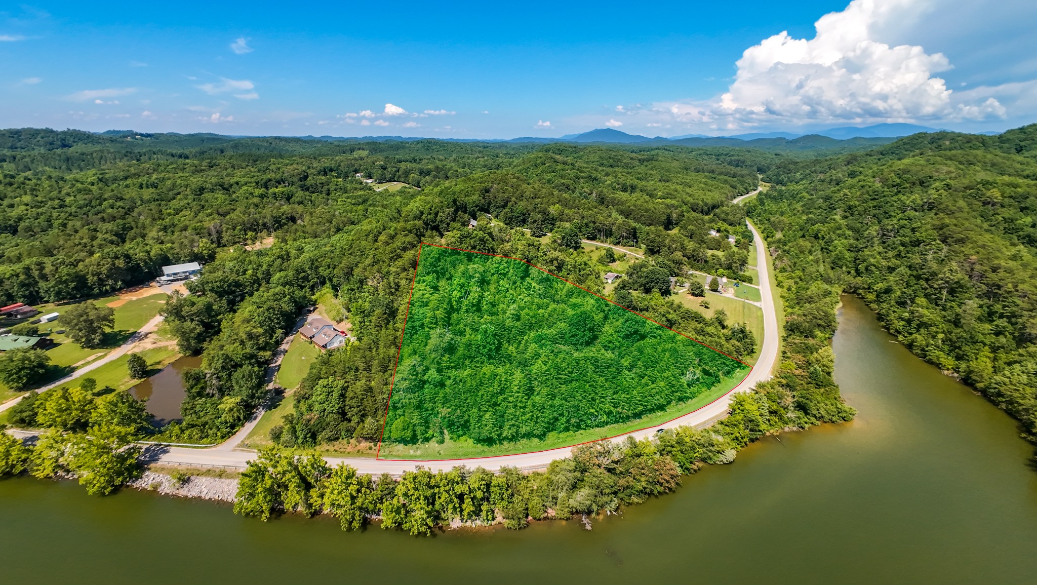 151 Citico Road Vonore, TN 37885 - Photo 20 of 23 a view of a lake with a yard
