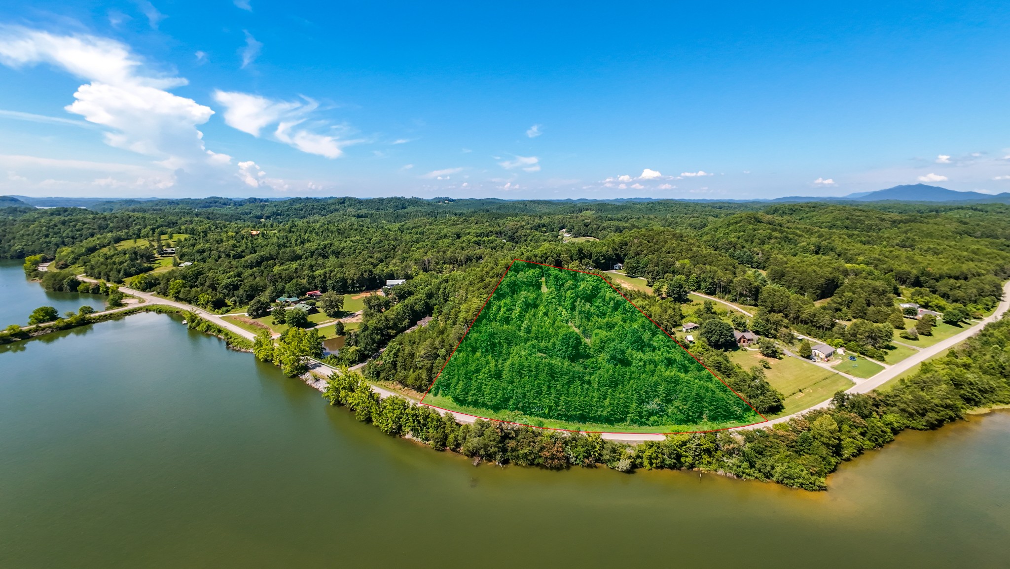 151 Citico Road Vonore, TN 37885 - Photo 21 of 23 a view of a lake with a city