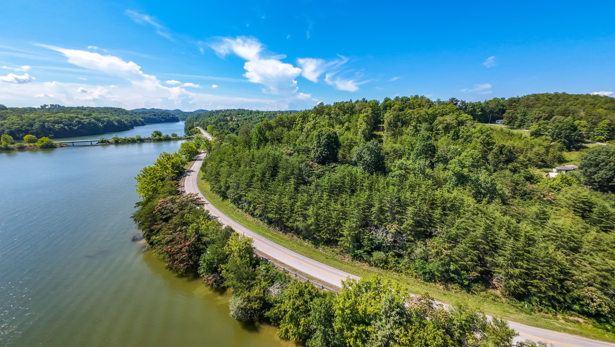 151 Citico Road Vonore, TN 37885 - Photo 3 of 23 a view of a lake with a city