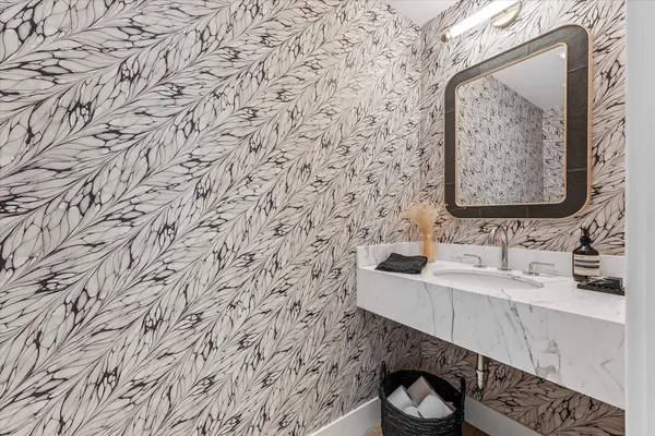 a bathroom with a sink and a mirror