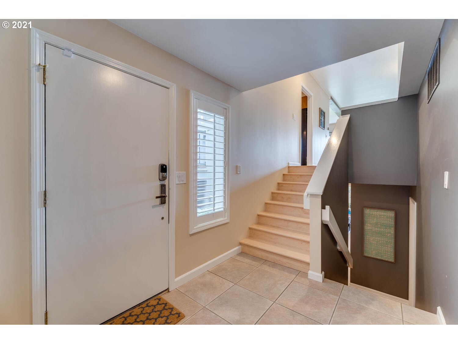 5441 Southwest View Point Terrace Portland, OR 97239 - Photo 3 of 32 a view of entryway with stairs and wooden floor