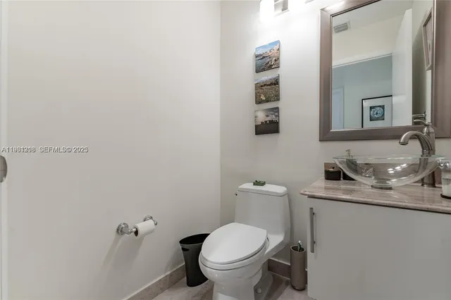 a balcony view with two chairs and a table