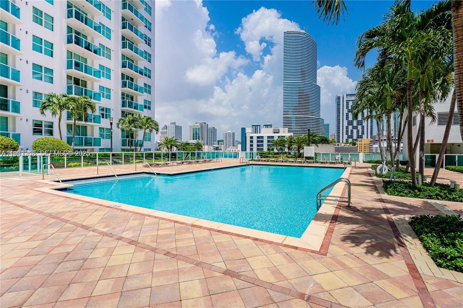 31 Southeast 5th Street, Unit 3716 Miami, FL 33131 - Photo 25 of 37 a view of a swimming pool and a buildings