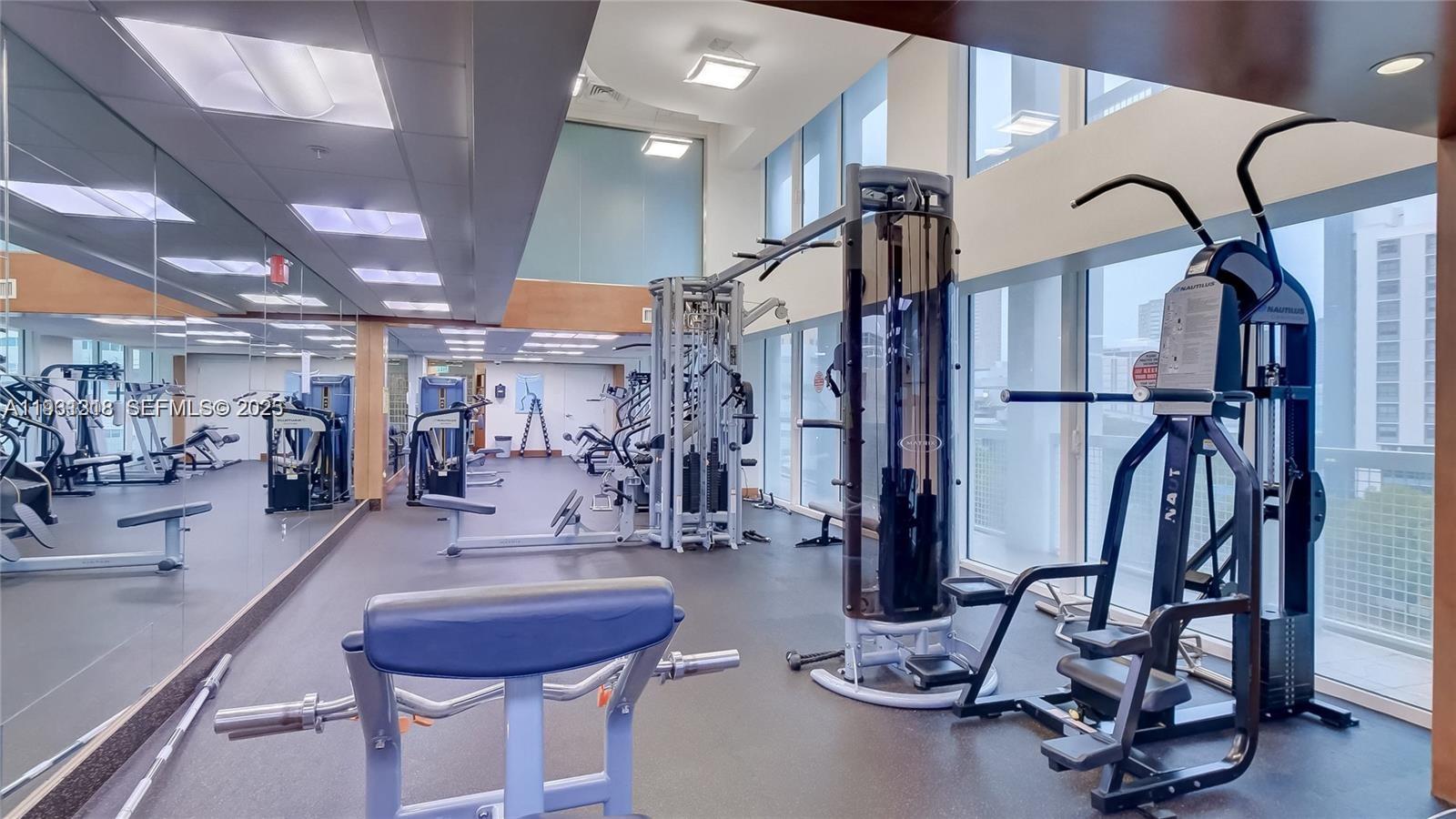 31 Southeast 5th Street, Unit 3716 Miami, FL 33131 - Photo 27 of 37 a view of a room with gym equipment