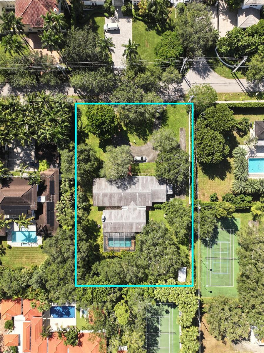 an aerial view of residential house with outdoor space