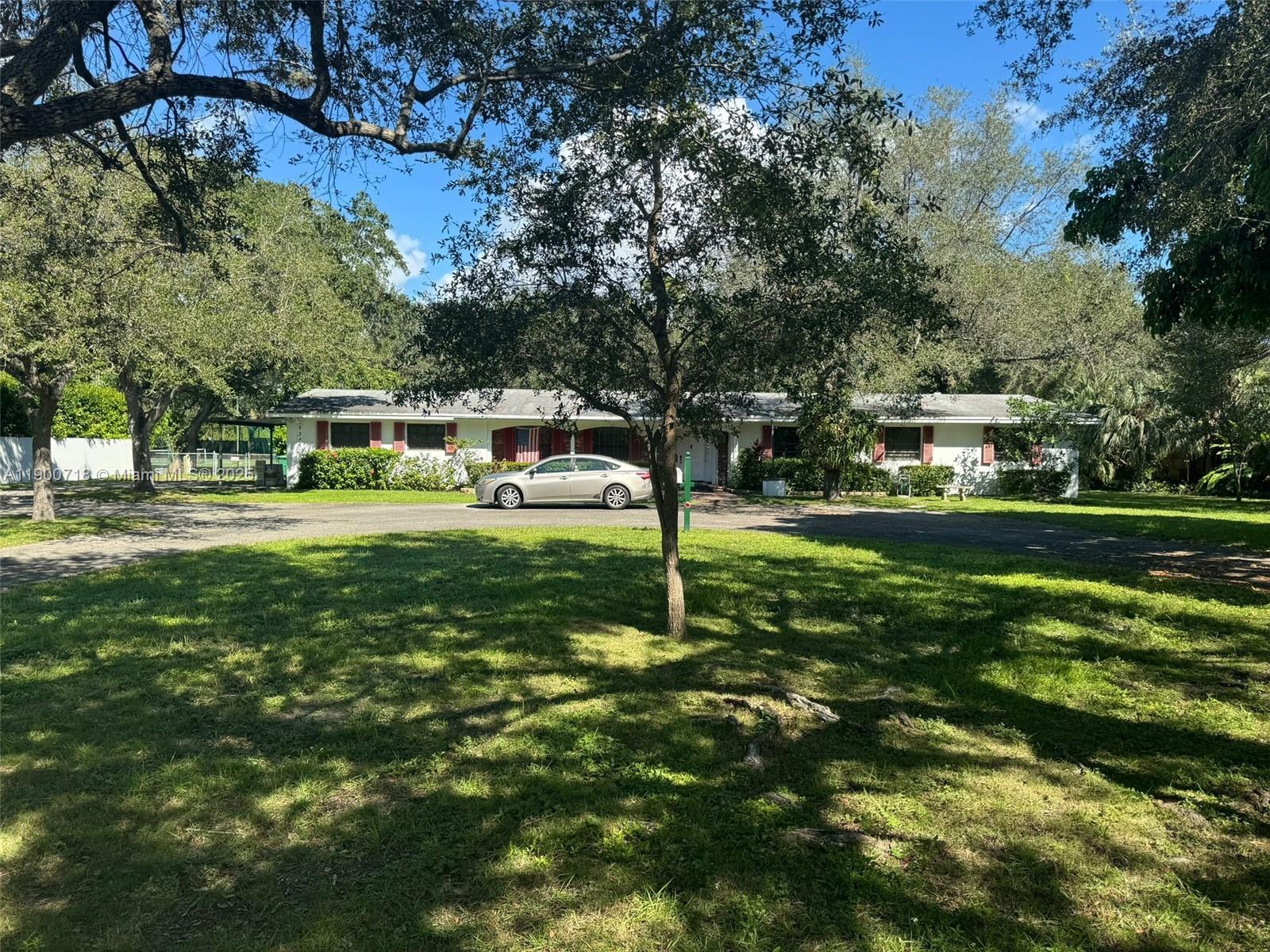 5345 Southwest 84th Street Miami, FL 33143 - Photo 11 of 15 a view of a park with large trees