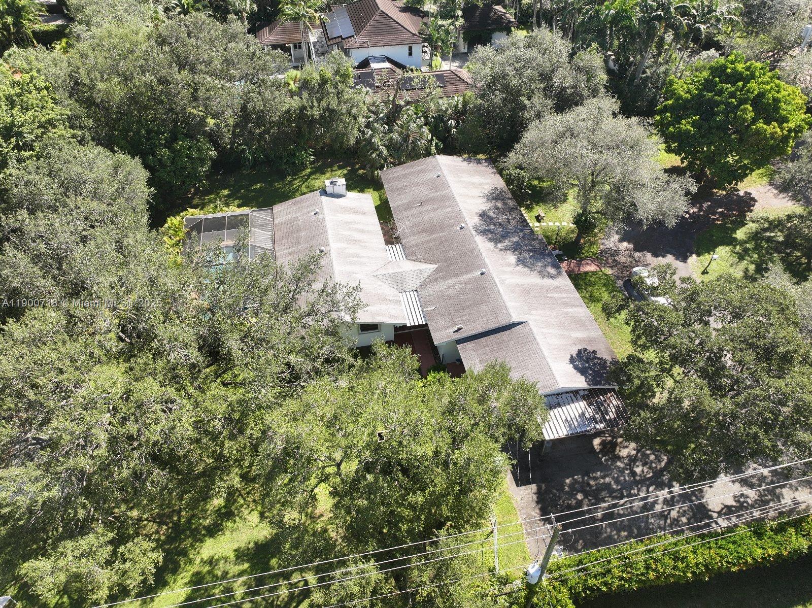 5345 Southwest 84th Street Miami, FL 33143 - Photo 9 of 15 an aerial view of a house with a yard and lake view