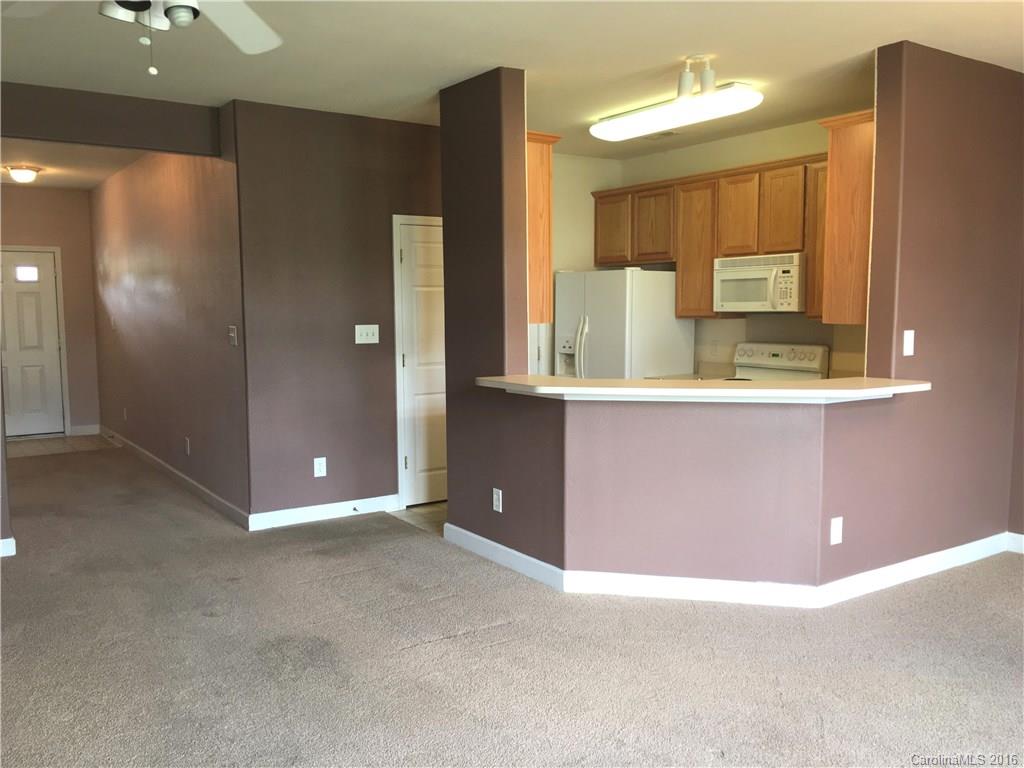 3062 Priory Ridge Drive Fort Mill, SC 29707 - Photo 12 of 24 a view of a kitchen cabinets and a room with wooden floor