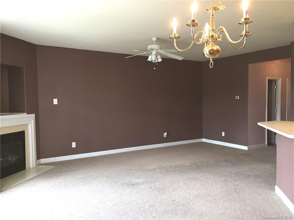 3062 Priory Ridge Drive Fort Mill, SC 29707 - Photo 9 of 24 a view of an empty room with a chandelier fan