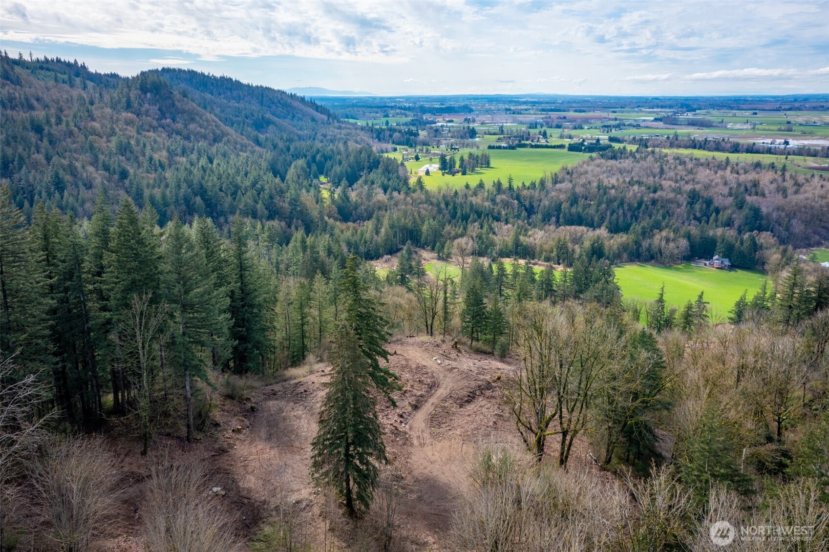 48-xx Reese Hill Road Sumas, WA 98295 - Photo 15 of 22 a view of a lake with mountains in the background