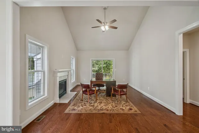 a bathroom with a granite countertop double vanity and a mirror