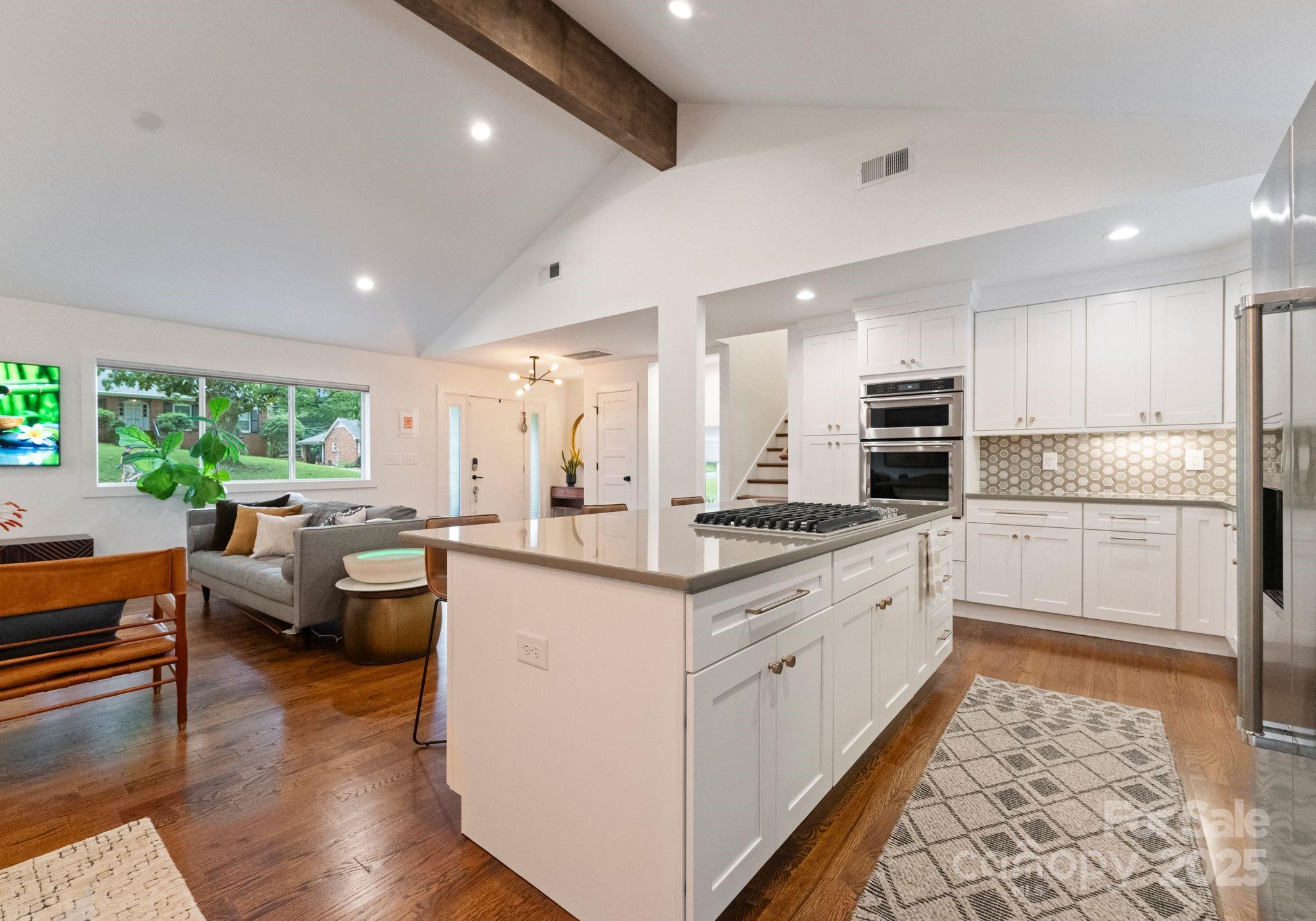 6527 Burlwood Road Charlotte, NC 28211 - Photo 11 of 43 a kitchen with white cabinets and white appliances