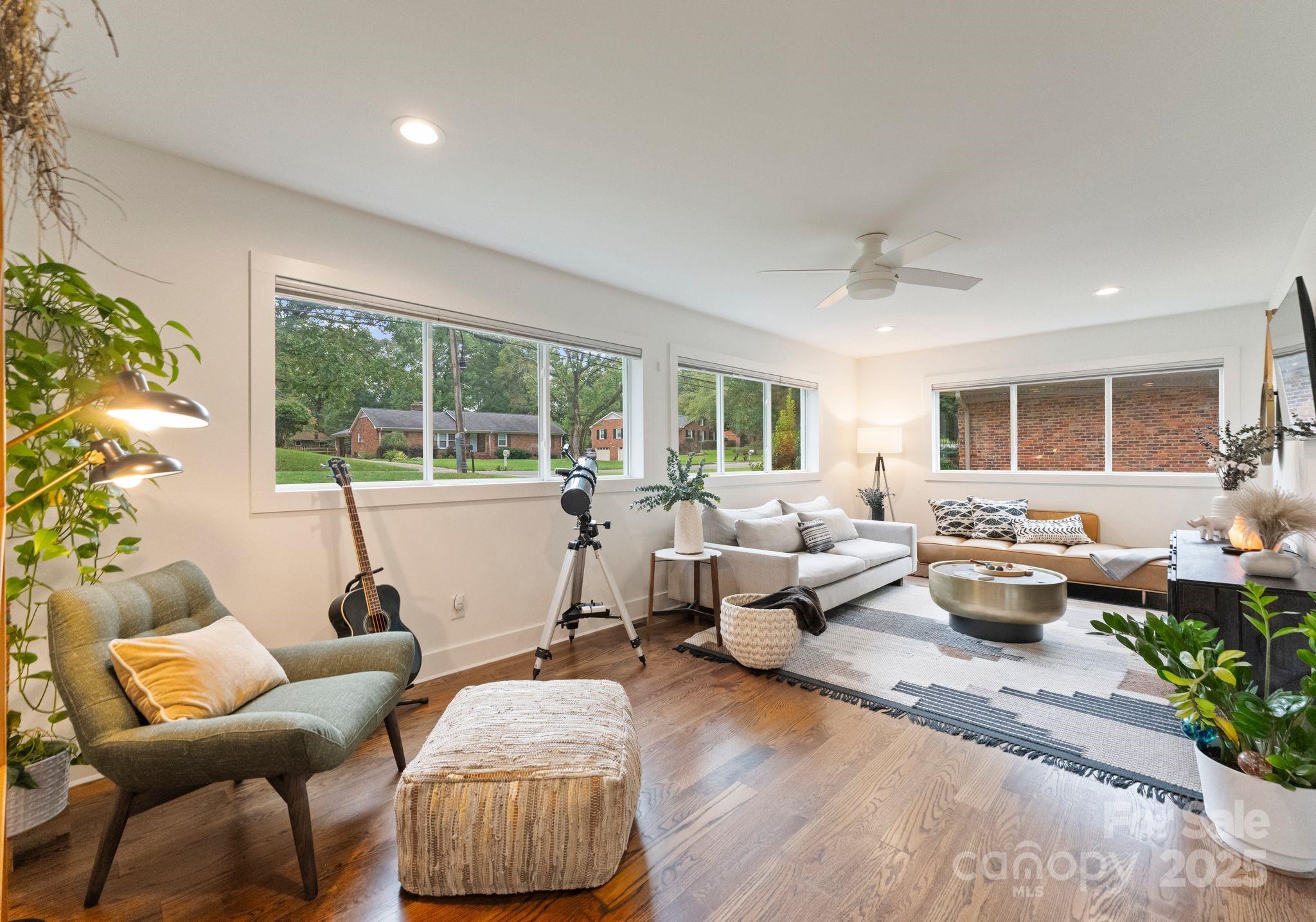 6527 Burlwood Road Charlotte, NC 28211 - Photo 19 of 43 a living room with furniture and a large window