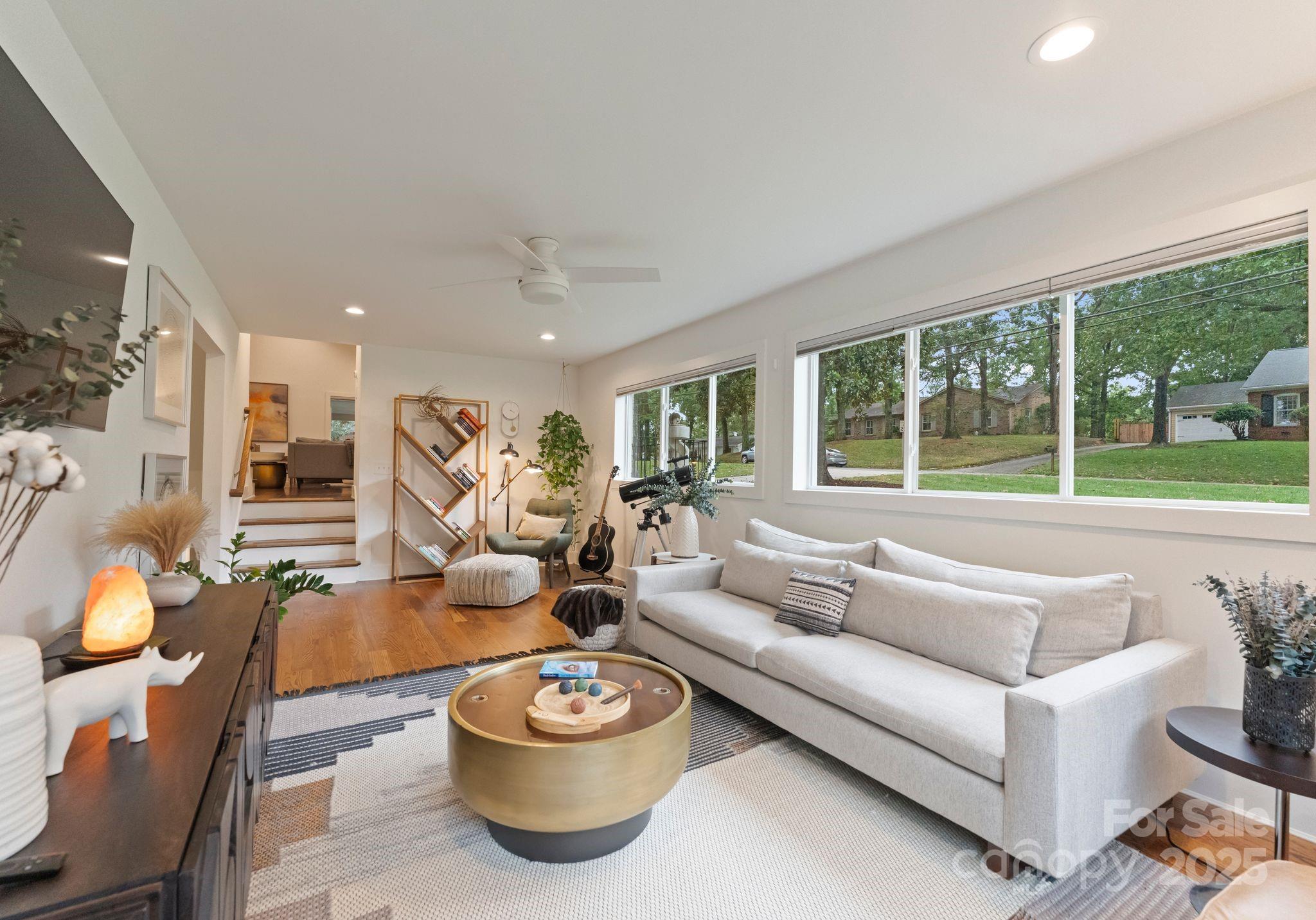 6527 Burlwood Road Charlotte, NC 28211 - Photo 20 of 43 a living room with furniture and a large window