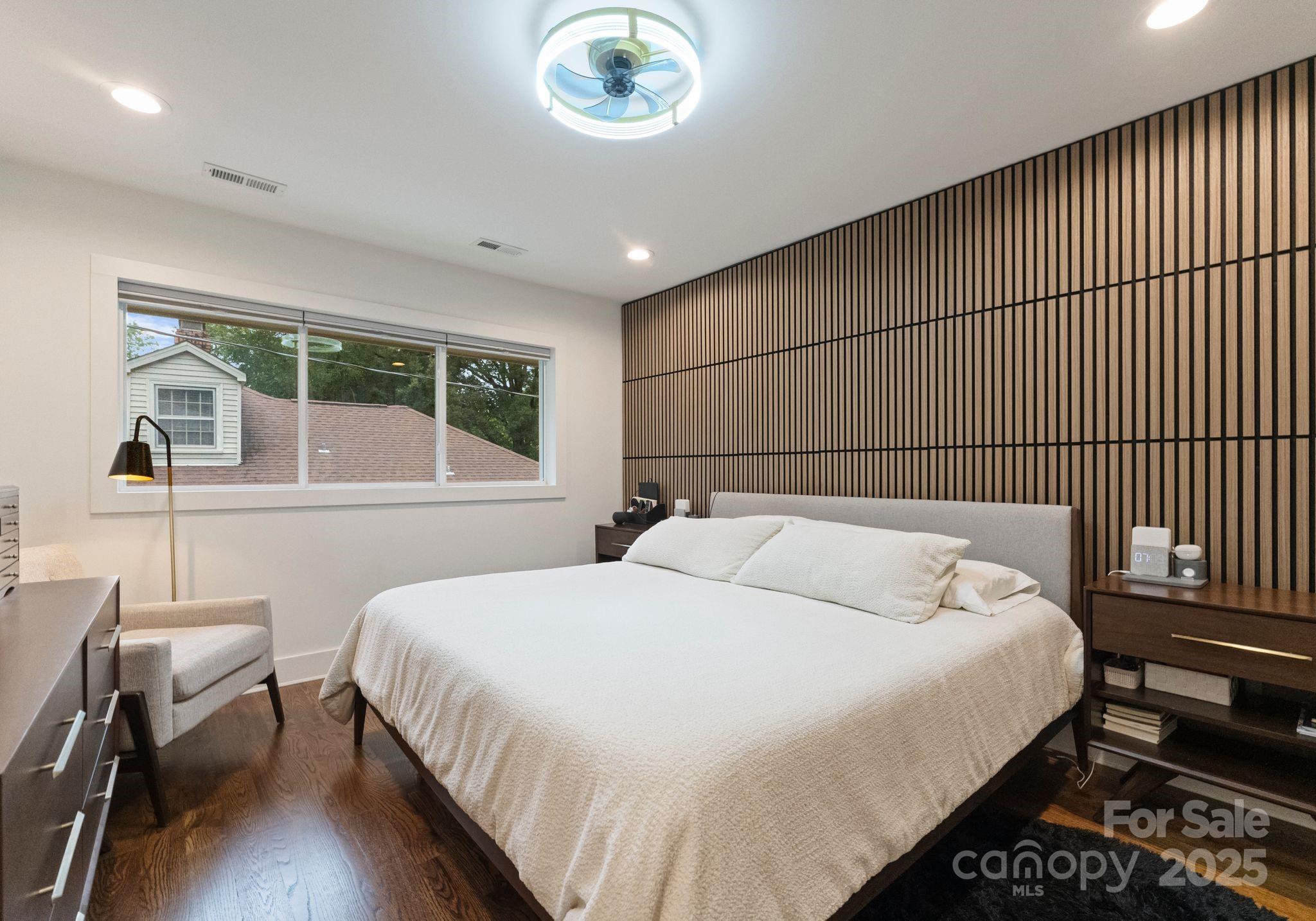 6527 Burlwood Road Charlotte, NC 28211 - Photo 28 of 43 a bedroom with a bed and a table