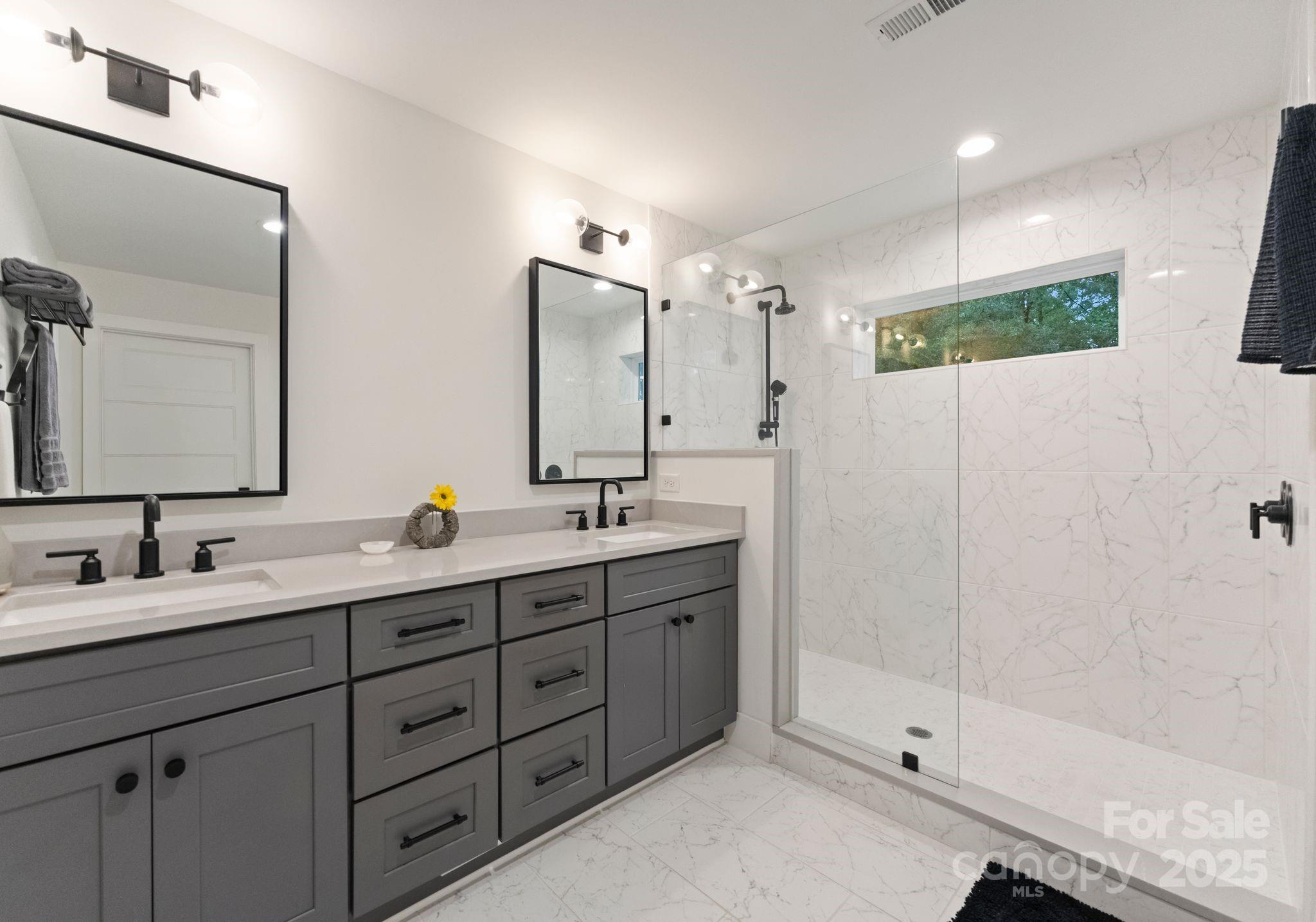6527 Burlwood Road Charlotte, NC 28211 - Photo 30 of 43 a bathroom with a double vanity sink mirror double and shower
