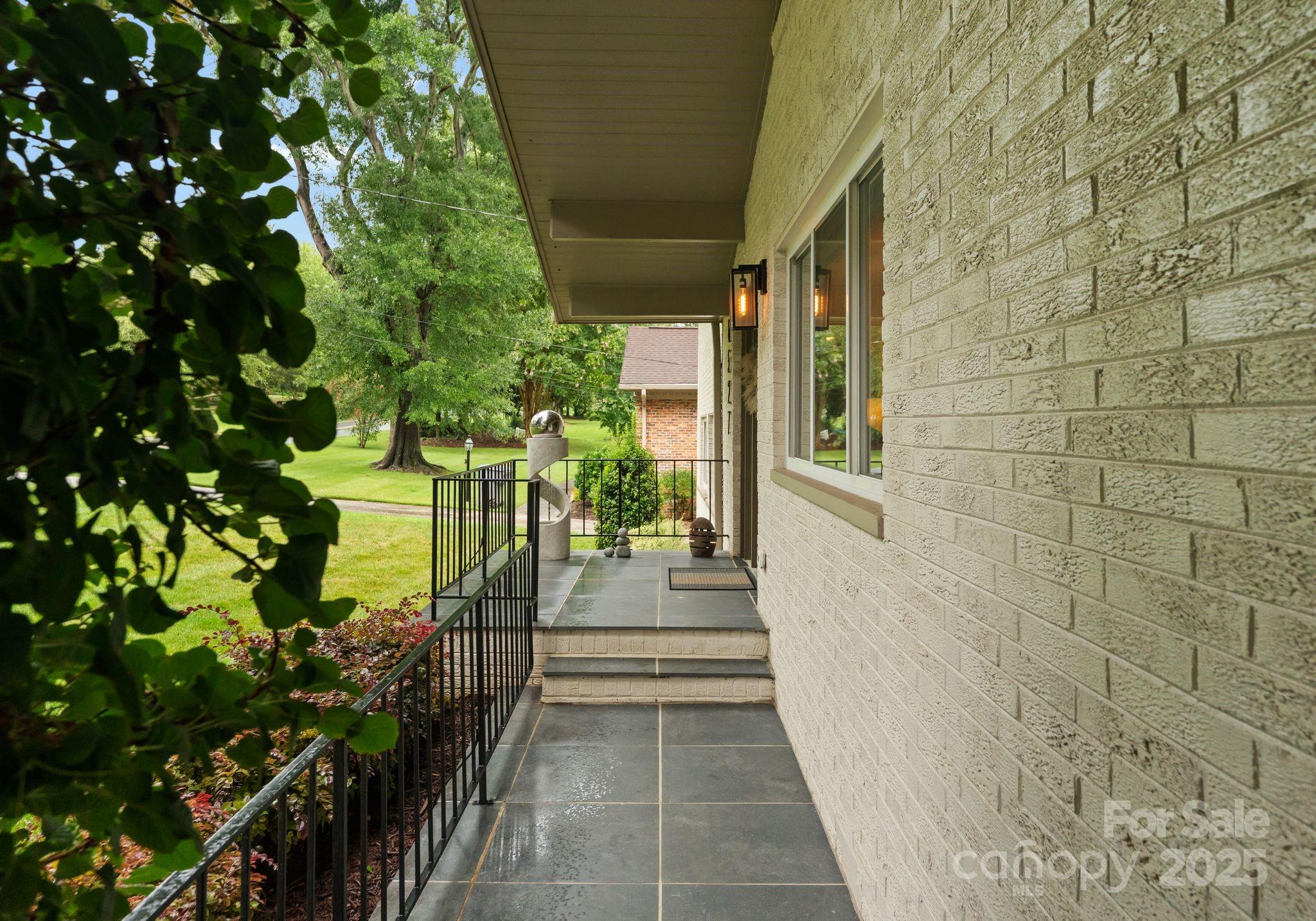 6527 Burlwood Road Charlotte, NC 28211 - Photo 3 of 43 a view of a pathway both side of house