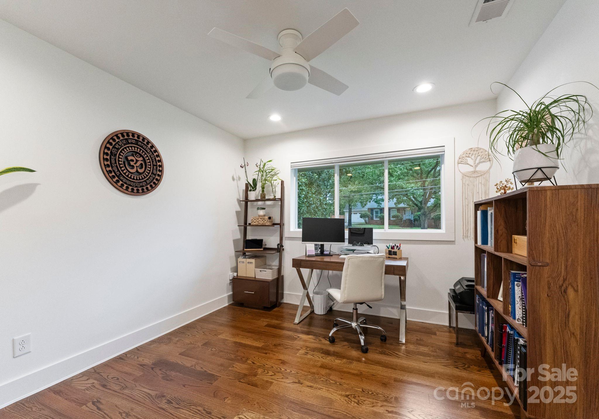 6527 Burlwood Road Charlotte, NC 28211 - Photo 32 of 43 a view of a workspace with furniture and a window