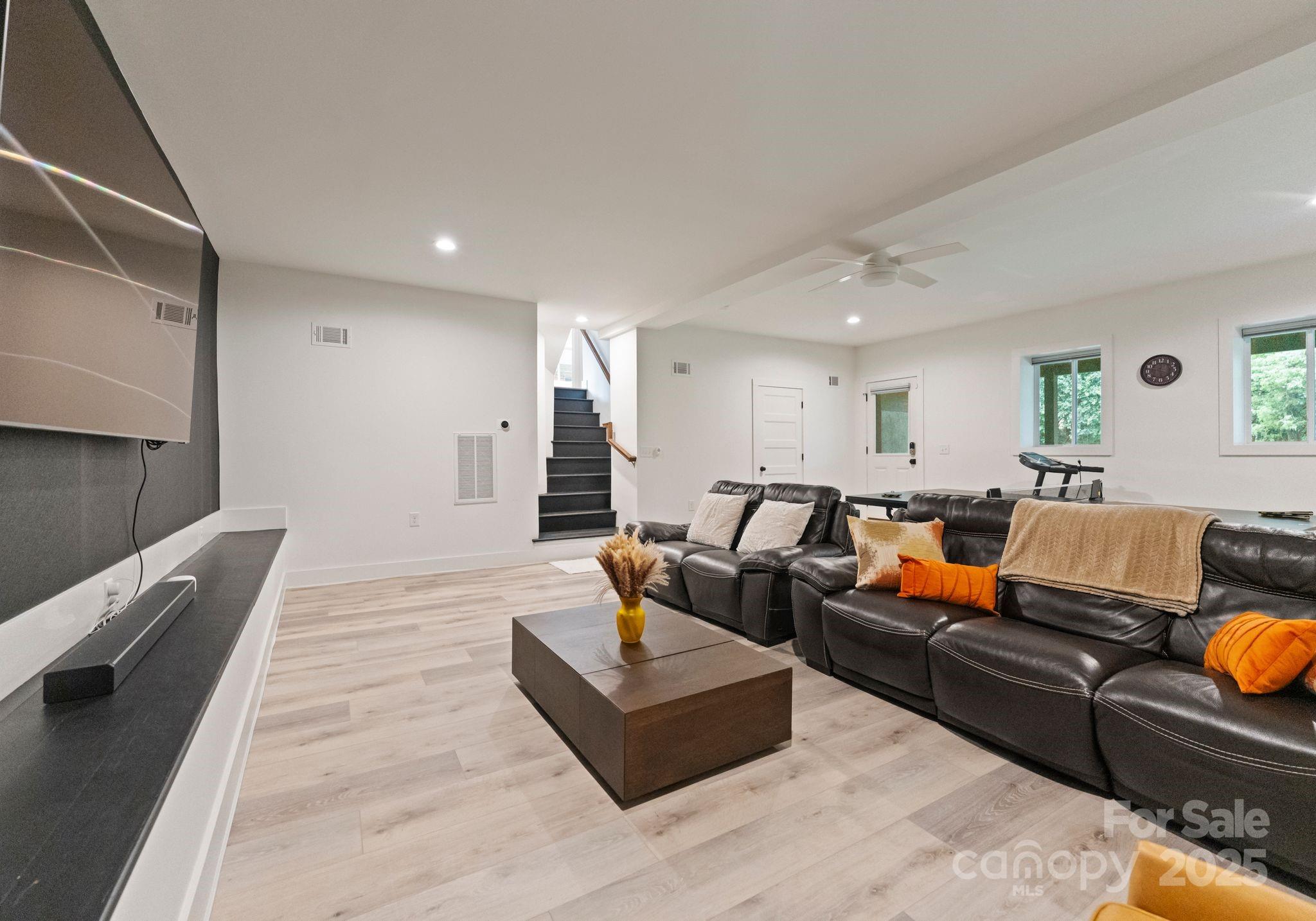 6527 Burlwood Road Charlotte, NC 28211 - Photo 34 of 43 a living room with furniture and wooden floor