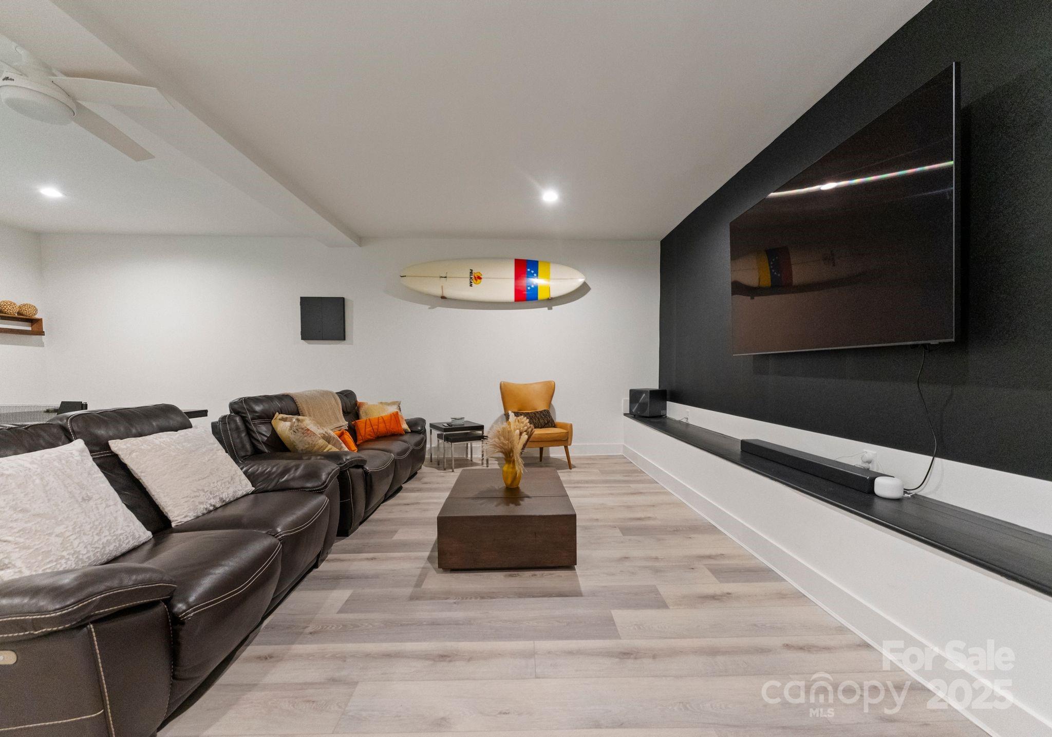 6527 Burlwood Road Charlotte, NC 28211 - Photo 36 of 43 a living room with furniture and a flat screen tv