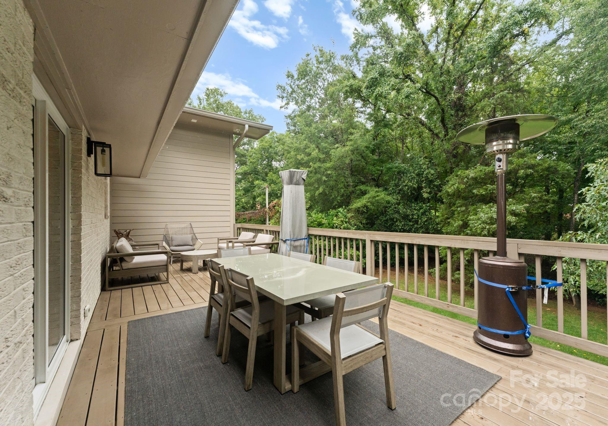 6527 Burlwood Road Charlotte, NC 28211 - Photo 37 of 43 a view of a dinning table and chairs in the balcony