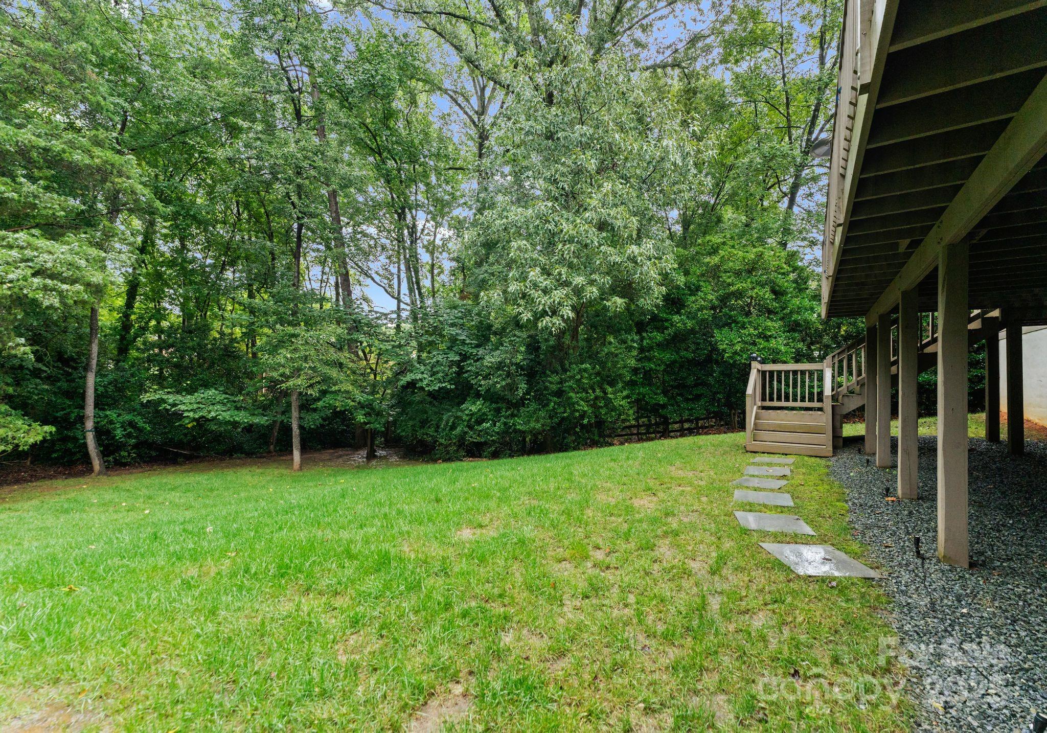 6527 Burlwood Road Charlotte, NC 28211 - Photo 40 of 43 a view of a backyard with a trees