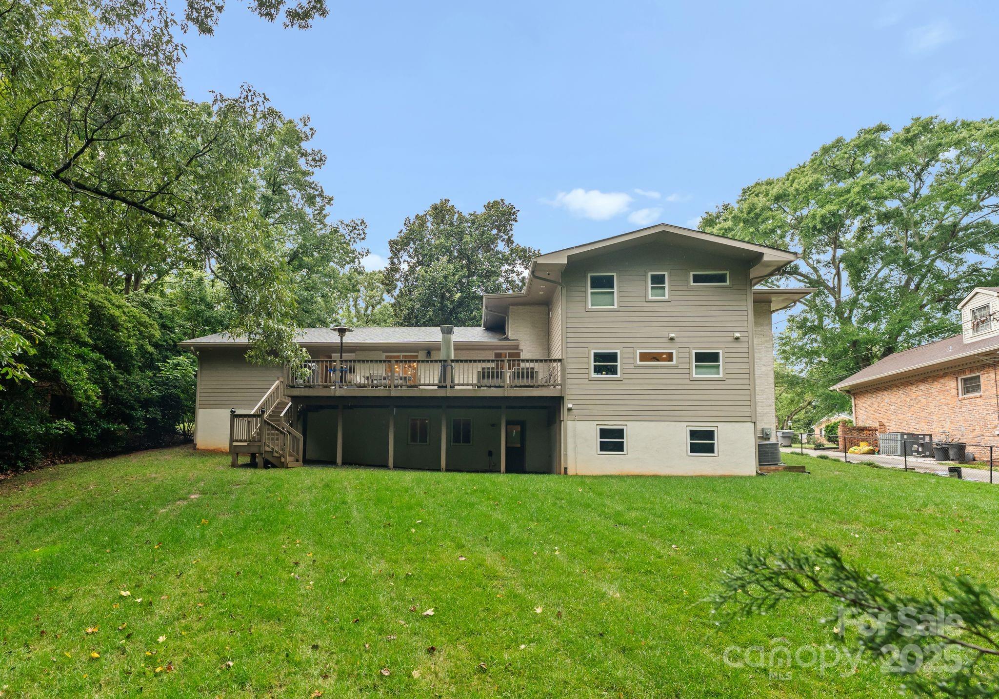 6527 Burlwood Road Charlotte, NC 28211 - Photo 41 of 43 a front view of a house with a yard and garage
