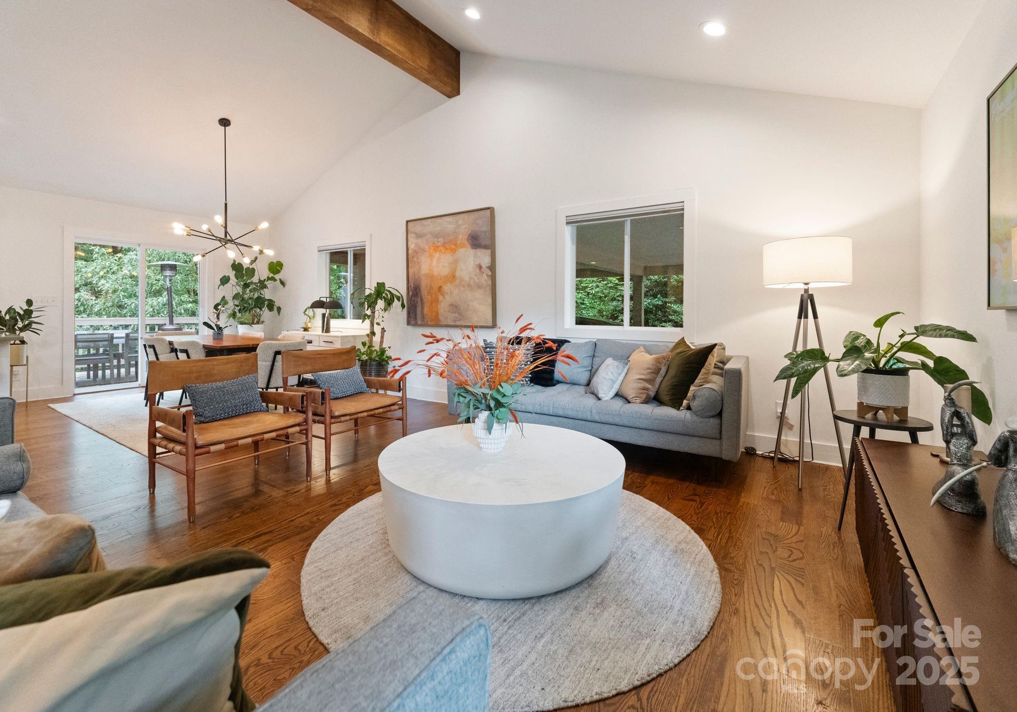 6527 Burlwood Road Charlotte, NC 28211 - Photo 8 of 43 a living room with furniture and a chandelier