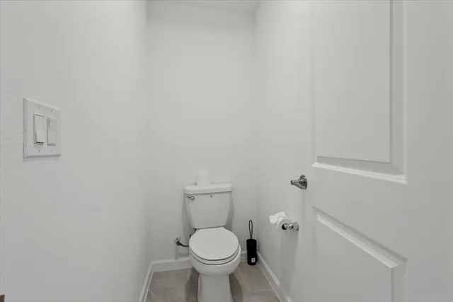 a bathroom with a toilet and a sink