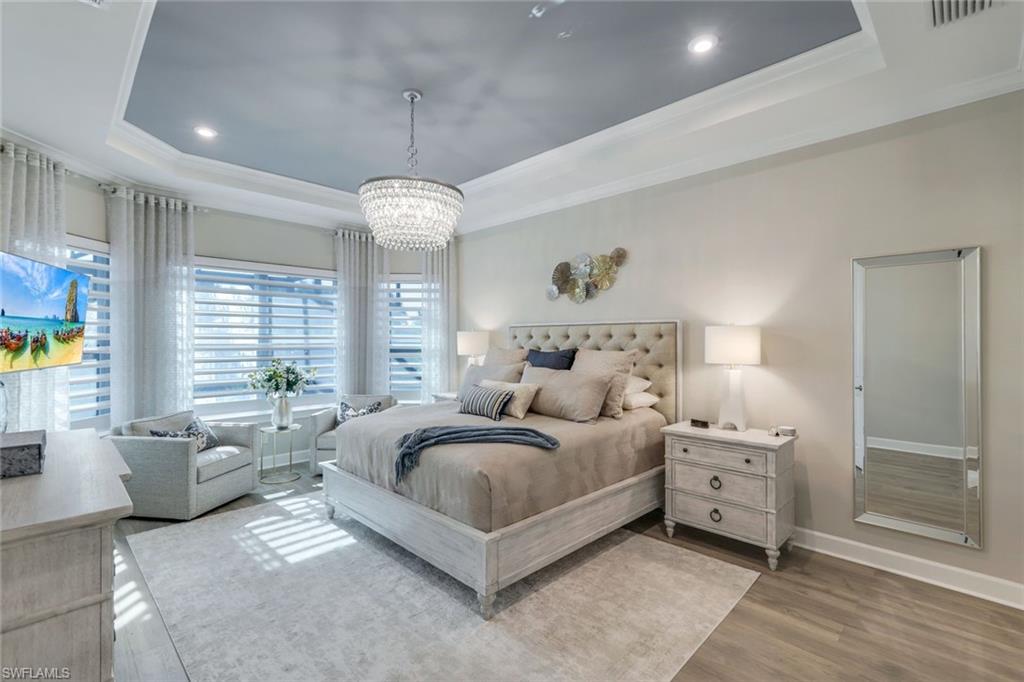 8935 Cappello Court Naples, FL 34119 - Photo 13 of 50 a bedroom with bed and window