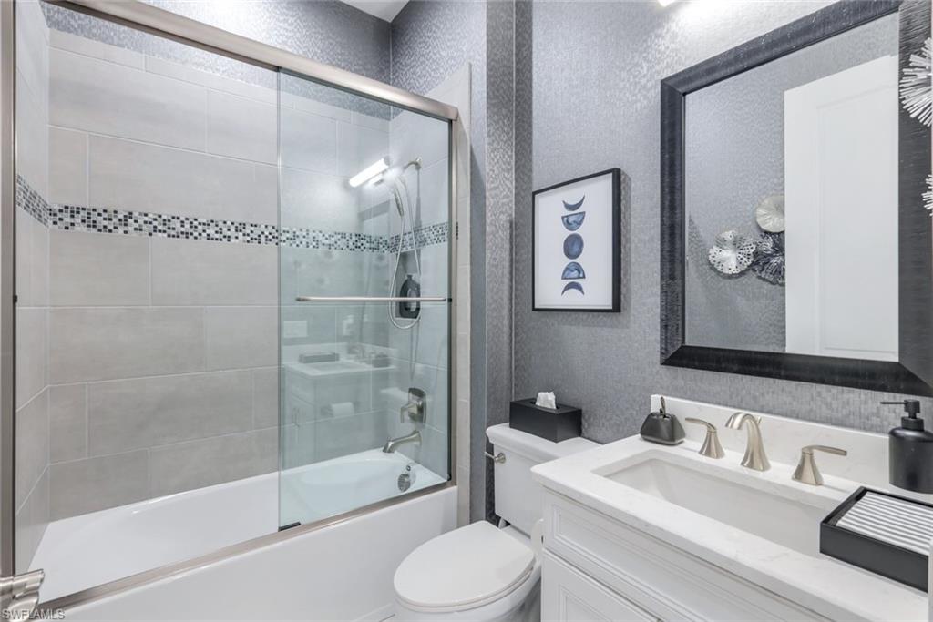 8935 Cappello Court Naples, FL 34119 - Photo 18 of 50 a bathroom with a sink toilet and shower