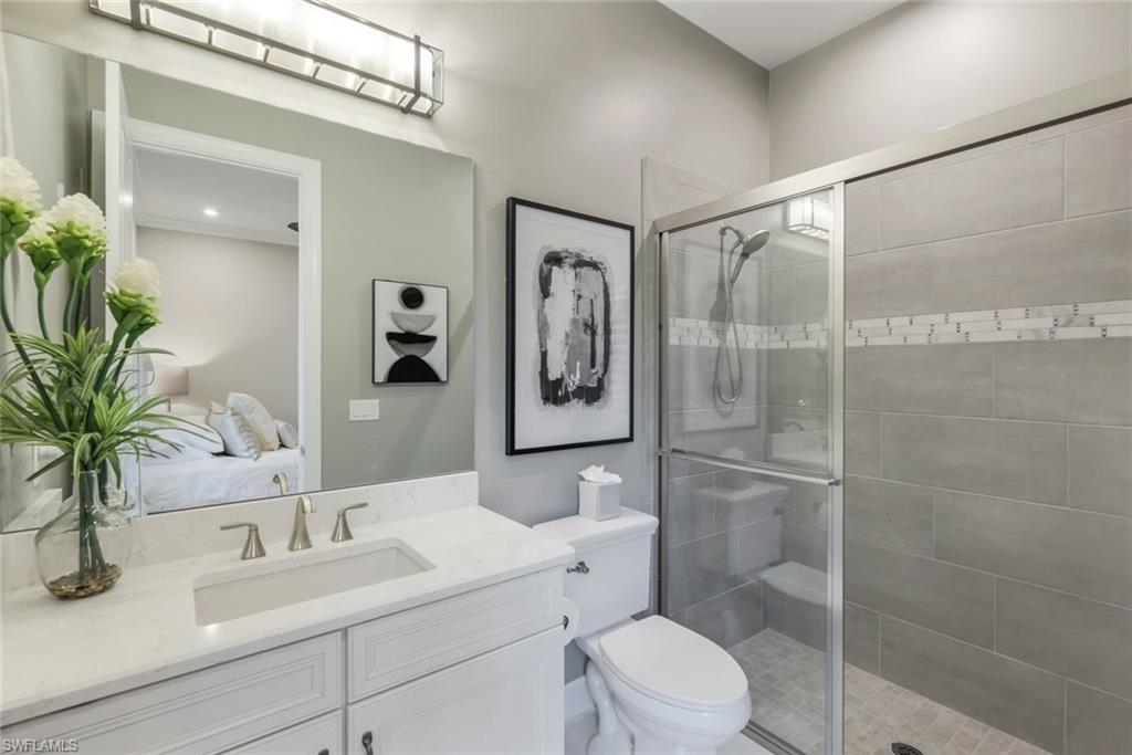 8935 Cappello Court Naples, FL 34119 - Photo 20 of 50 a bathroom with a sink a toilet and shower