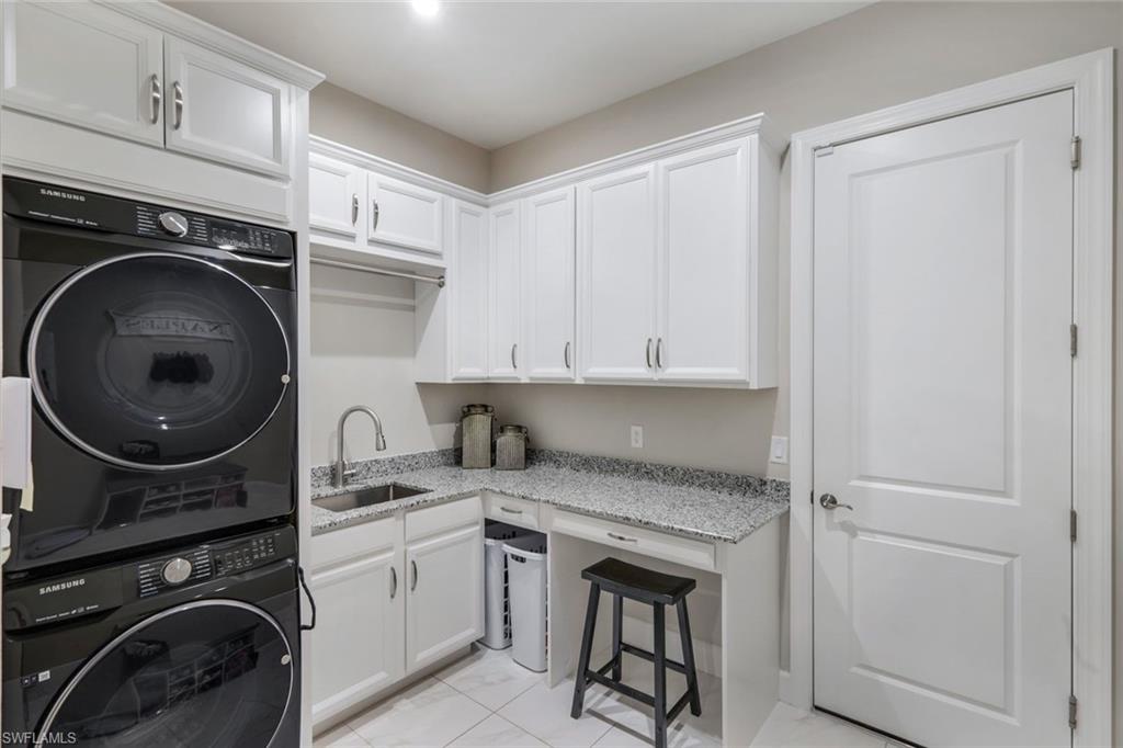 8935 Cappello Court Naples, FL 34119 - Photo 21 of 50 a utility room with sink dryer and washer