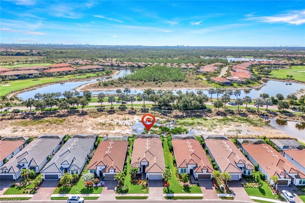 8935 Cappello Court Naples, FL 34119 - Photo 30 of 50 an aerial view of residential building and ocean