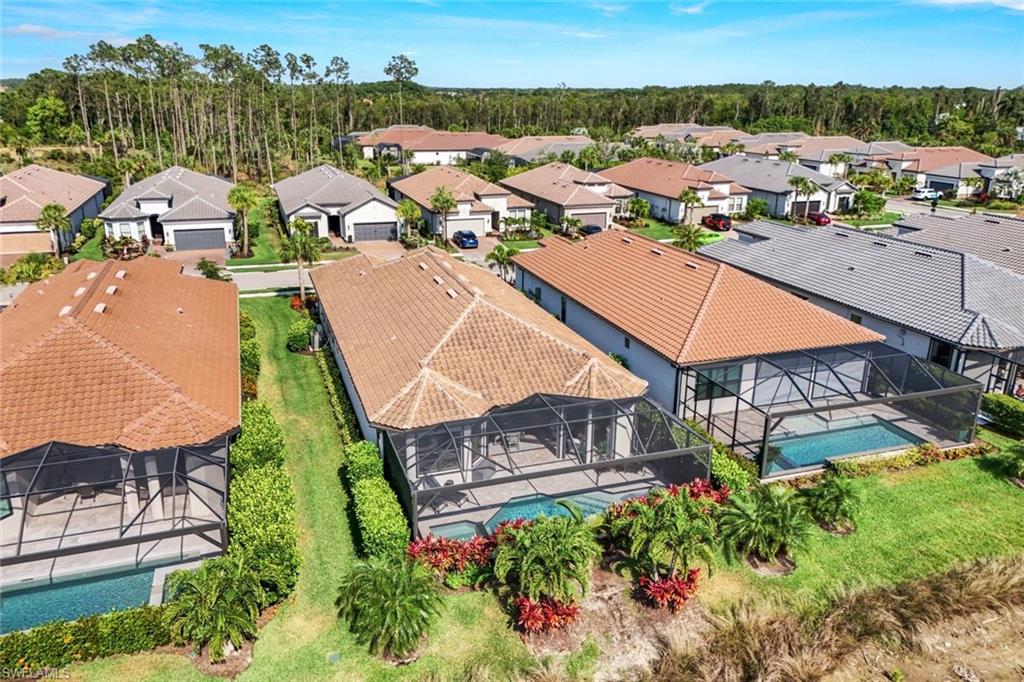8935 Cappello Court Naples, FL 34119 - Photo 31 of 50 an aerial view of a house with a garden