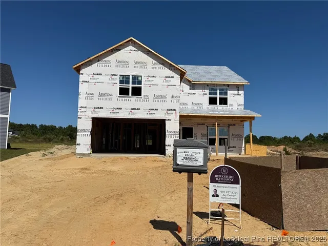 a front view of a house with yard