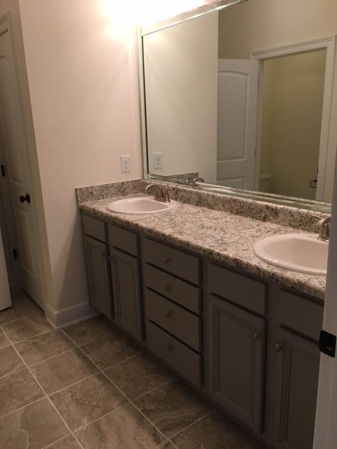 19 Viper Road Santa Rosa Beach, FL 32459 - Photo 10 of 20 a bathroom with a granite countertop sink and a mirror