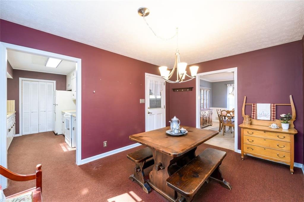 4304 Riverside Drive Southwest Lilburn, GA 30047 - Photo 13 of 33 a view of a dining room with furniture