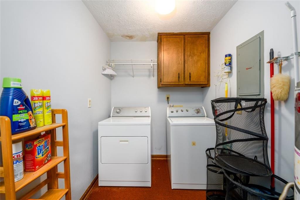 4304 Riverside Drive Southwest Lilburn, GA 30047 - Photo 14 of 33 a utility room with dryer and washer