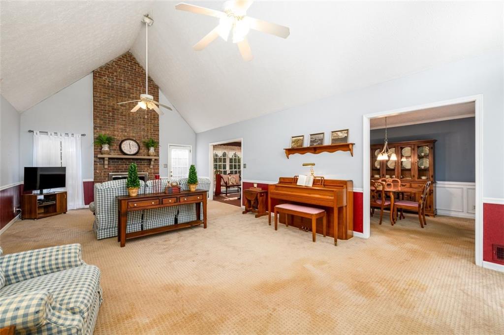 4304 Riverside Drive Southwest Lilburn, GA 30047 - Photo 16 of 33 a living room with furniture and a wooden floor
