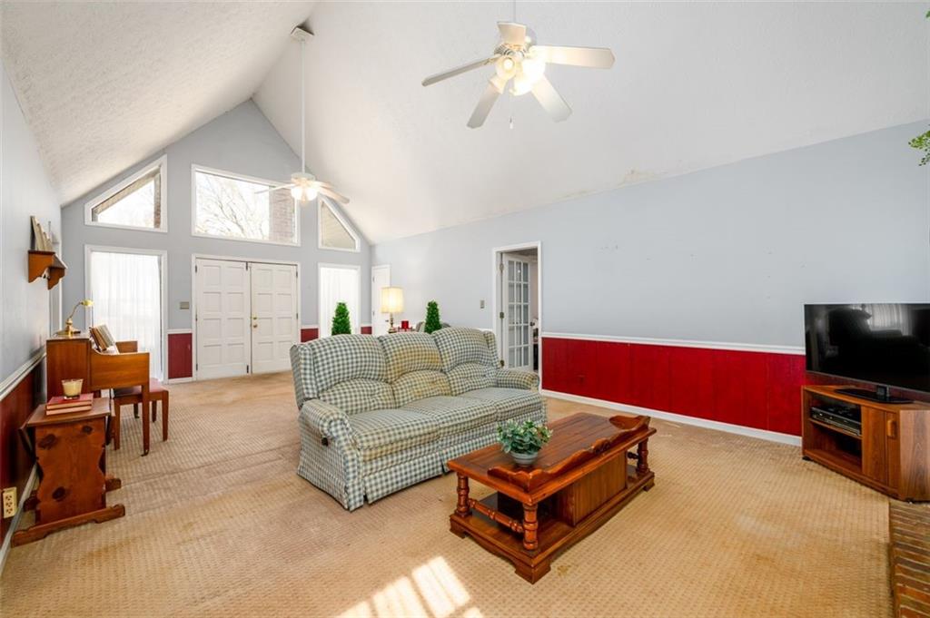 4304 Riverside Drive Southwest Lilburn, GA 30047 - Photo 18 of 33 a living room with furniture and a flat screen tv