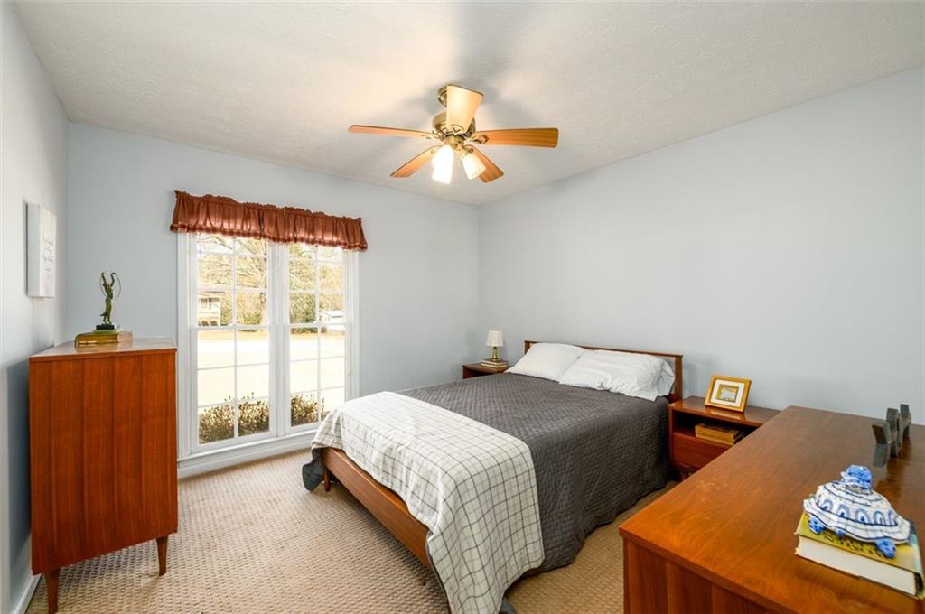 4304 Riverside Drive Southwest Lilburn, GA 30047 - Photo 22 of 33 a bedroom with two beds and a window
