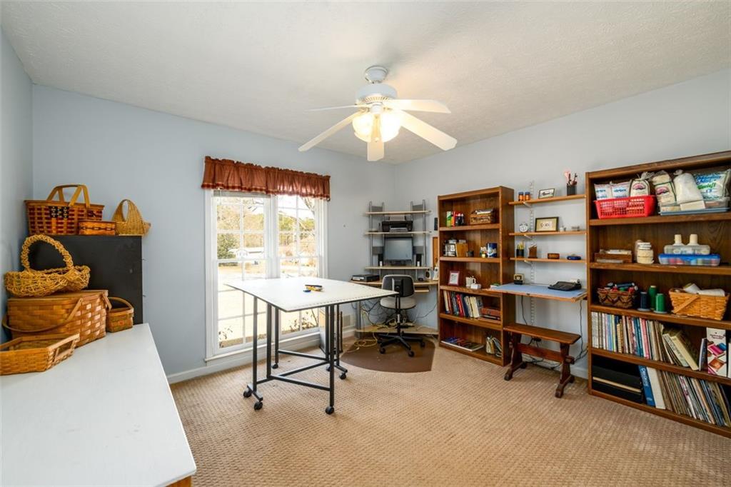 4304 Riverside Drive Southwest Lilburn, GA 30047 - Photo 24 of 33 a view of a workspace with furniture and a window