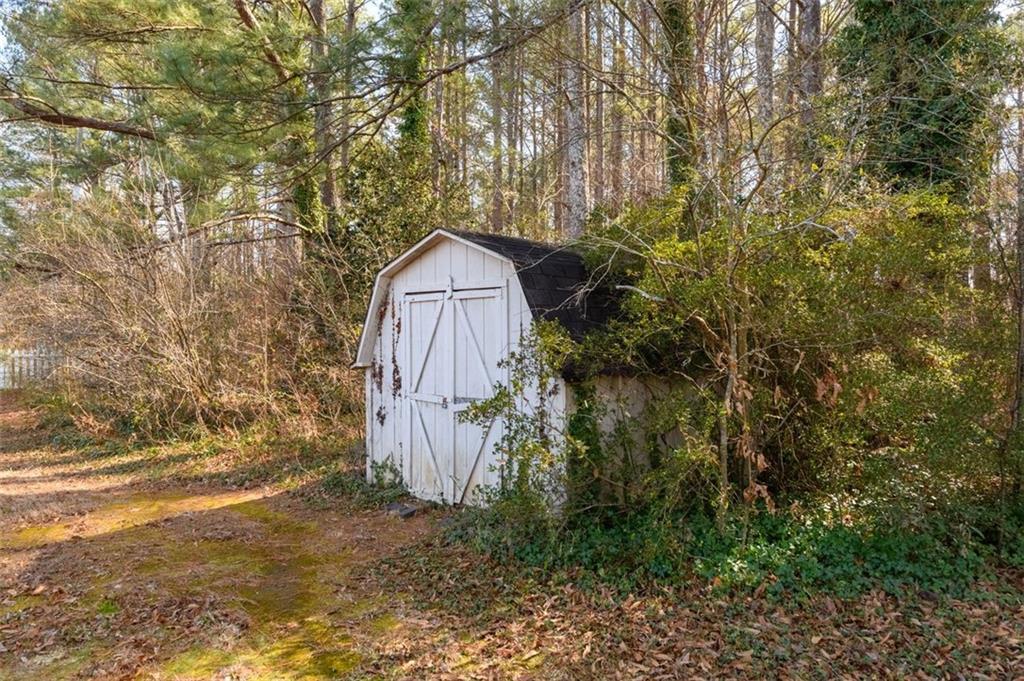 4304 Riverside Drive Southwest Lilburn, GA 30047 - Photo 33 of 33 a backyard of a house with lots of green space