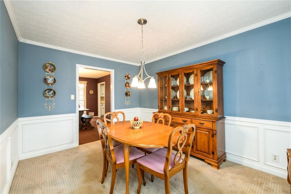 4304 Riverside Drive Southwest Lilburn, GA 30047 - Photo 6 of 33 a dining room with furniture and window