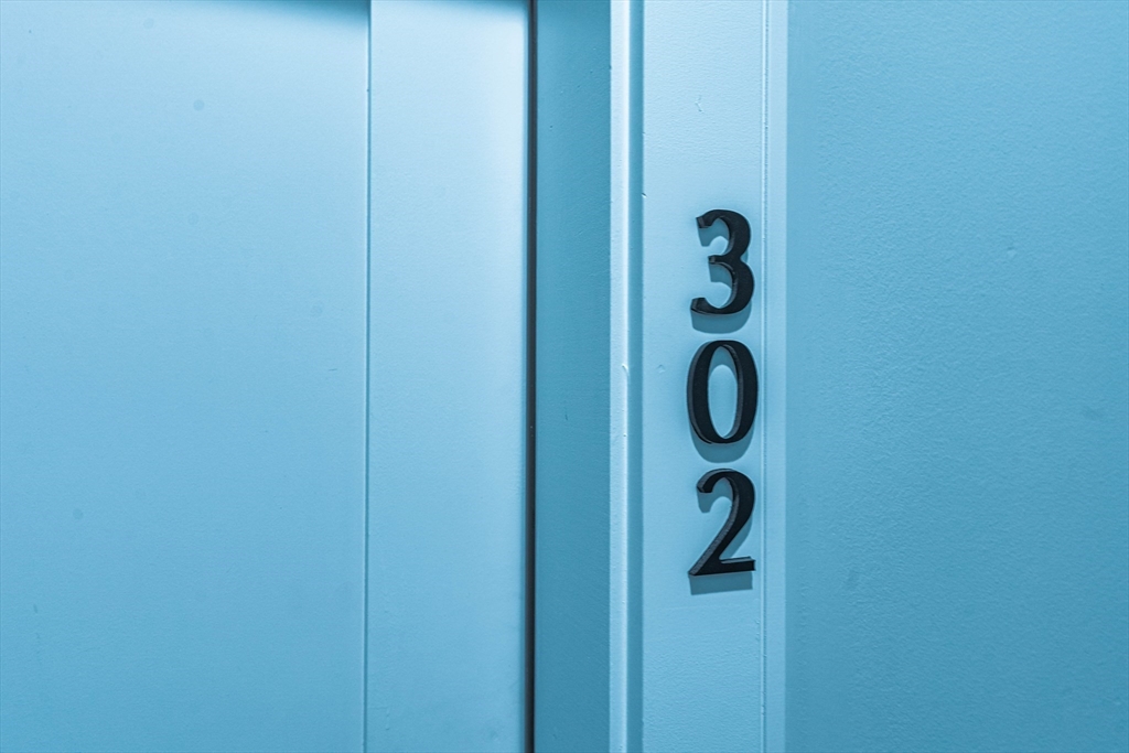 157 Everett Street, Unit 302 Boston, MA 02134 - Photo 11 of 11 a bathroom with a glass shower door